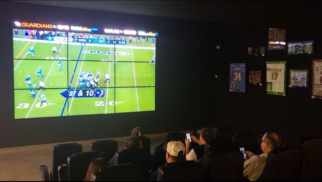 Spades Baytown movie theater seating with sports memorabilia